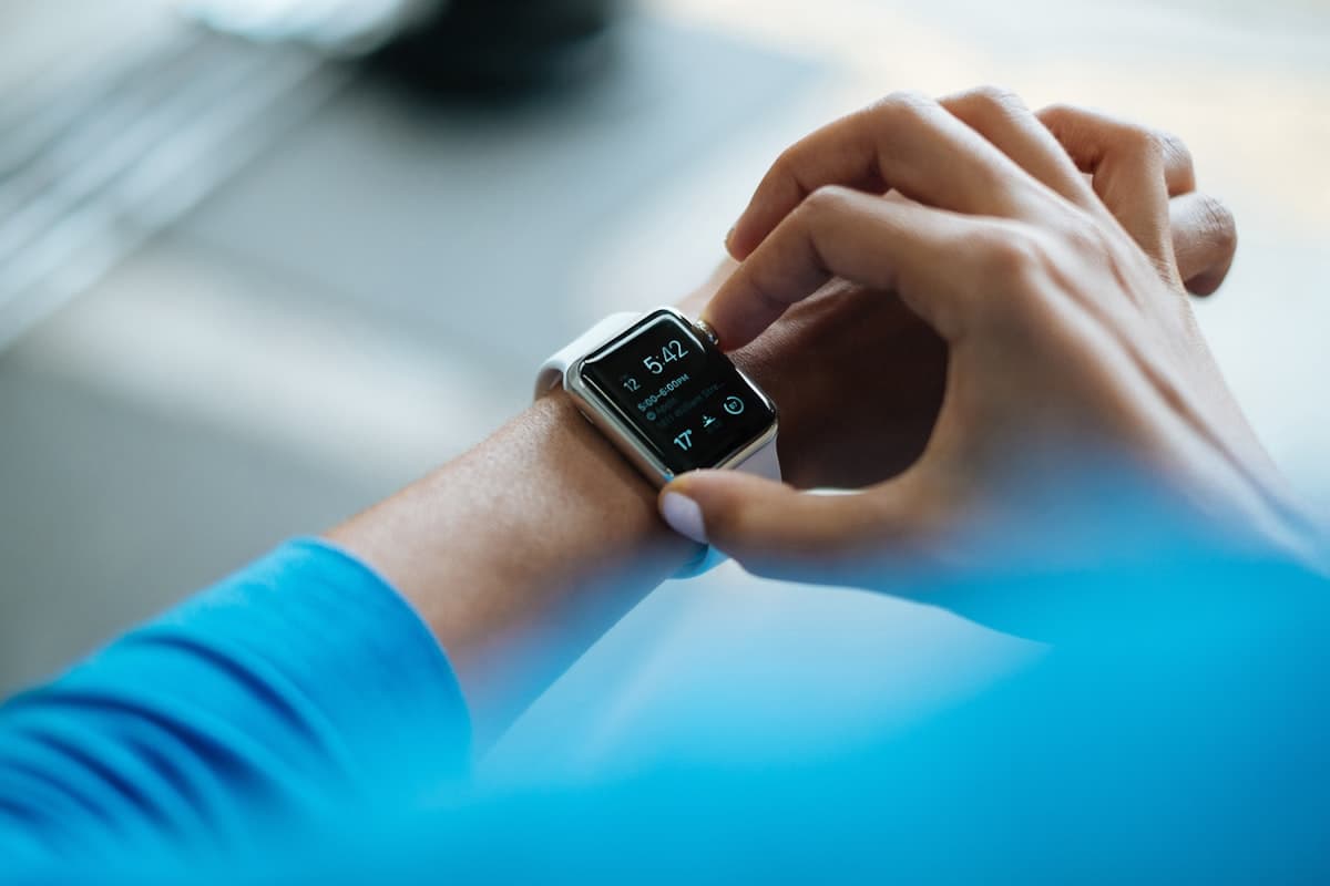 Apple Watch showing colorful activity rings on a wrist